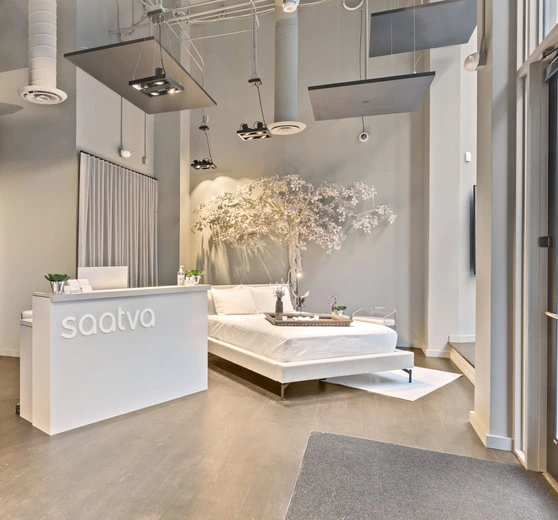 Saatva SF Interior with Tree and Check In Desk Left Side Closeup SlavaBlazerPhotography